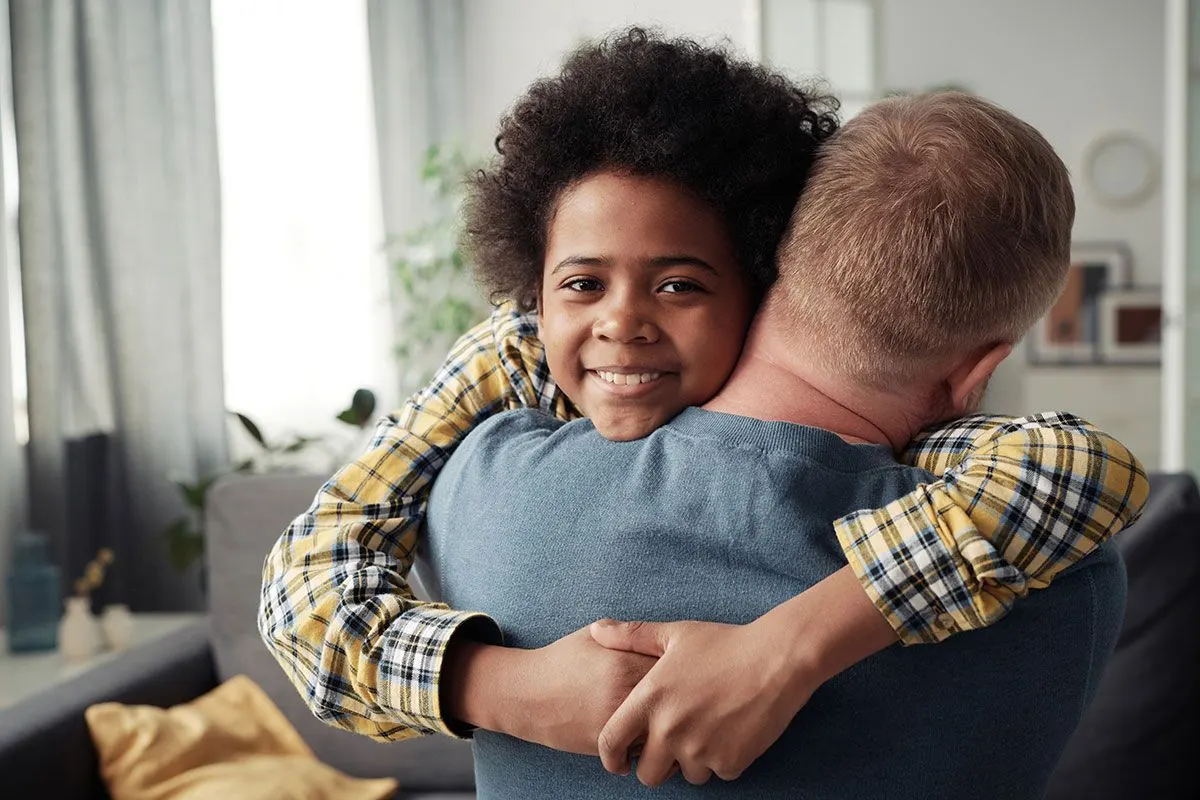 Foster boy embracing his foster dad – Short Term Fostering Types with Match Foster Care