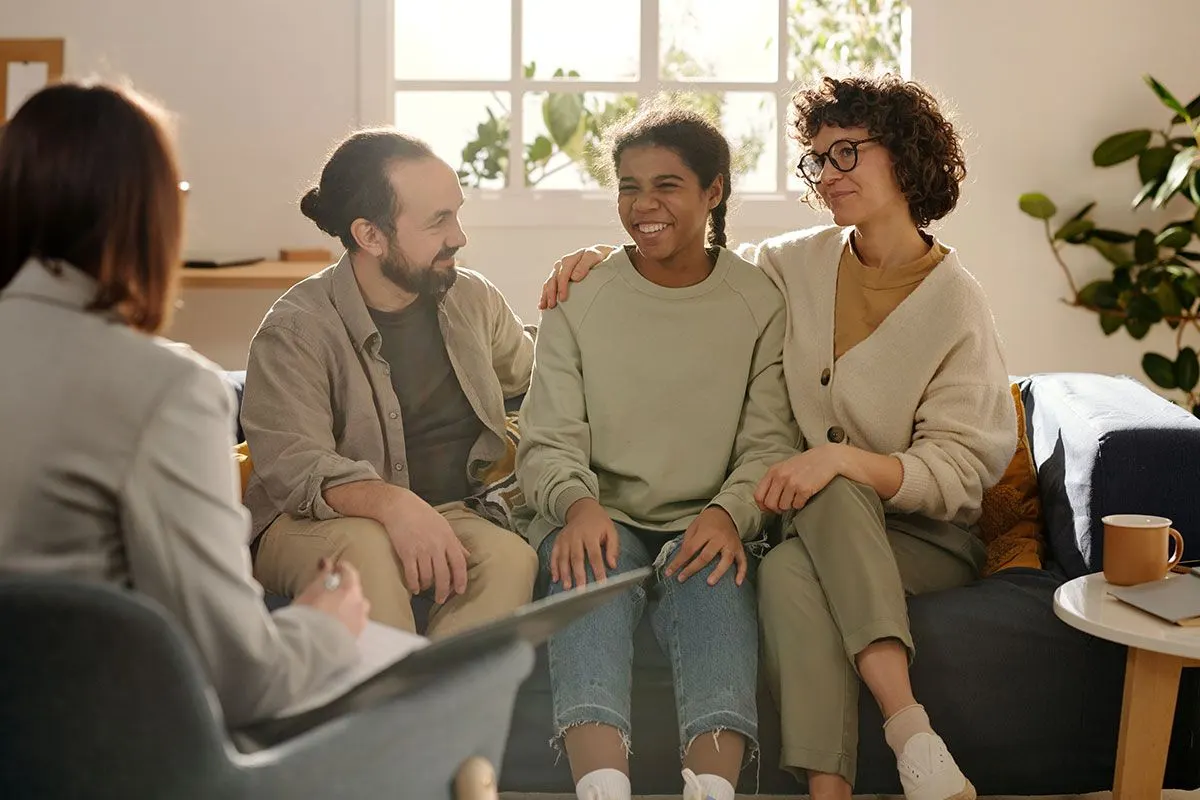 Foster parents talking to social worker – Long Term Fostering Options with Match Foster Care