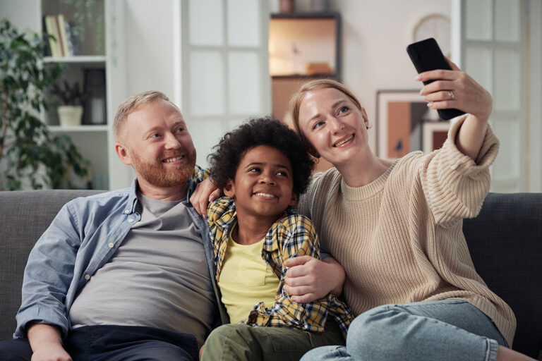 family-making-selfie-portrait-with-adopted-son-2025-02-11-15-44-25-utc