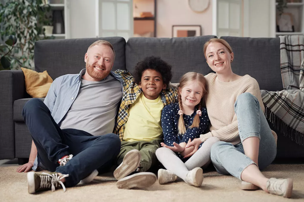 happy-foster-family-resting-at-home-2025-02-11-18-51-29-utc